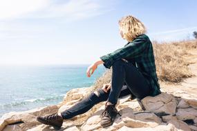 girl on Ocean rocks beach