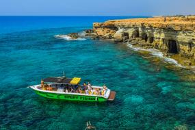 panoramic view of the boat with tourists on the coast of Cavo Greko