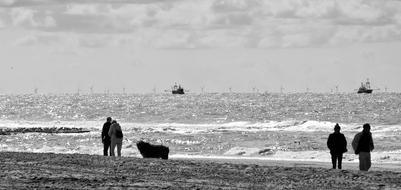 people on beach By The North Sea, black and white