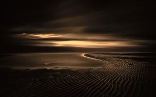 black twilight over the sandy beach