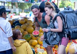 tourists with watermelon in the vietnam market