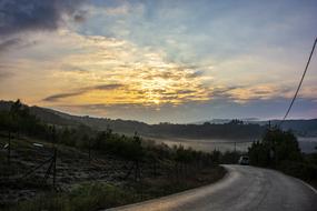sunset over the road in the countryside