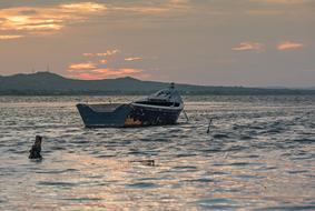 dusk over a boat in sardinia