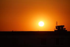 Landscape with silhouettes, on West, at colorful, gradient twilight