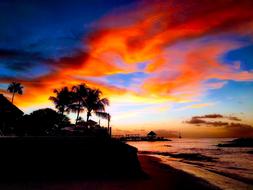 Beautiful landscape of the shore of Seychelles, with plants, at colorful and beautiful sunset with clouds