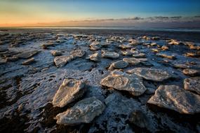 dark Rocks on north sea coast at dusk