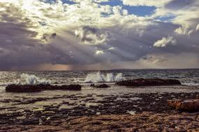 Beautiful landscape of the seashore with waves, in sunlight, under the blue sky with clouds, in Ayia Napa, Cyprus, Greece