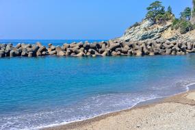 breakwater and sandy coast of the Sea of Japan