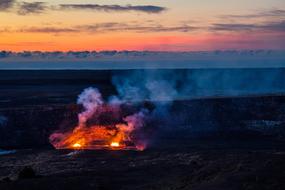 Beautiful landscape with the fire in Volcanoes National Park, Hawaii, USA, at colorful and beautiful sunset