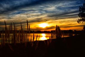 Sunset over calm water, rural Landscape