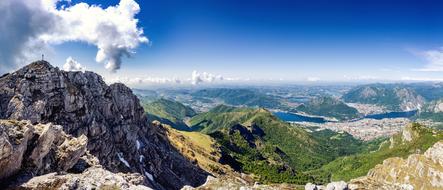 Beautiful landscape of the colorful mountains with plants, in sunlight, under the blue sky with wcloud