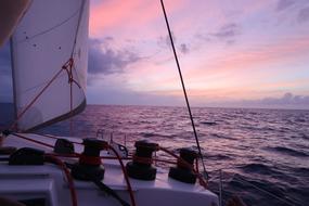 View of the waterscape with ripple, at colorful and beautiful sunset, from the catamaran
