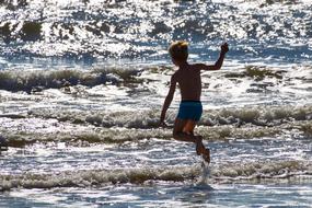 Child Jump on Sea