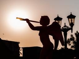 silhouette of an angel statue in the evening in venezuela