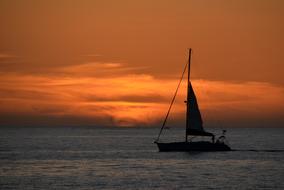 Sailing boat at Sunset Sea Ocean