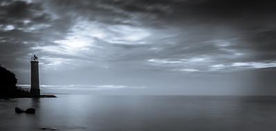 black and white, lighthouse on the shore of the island