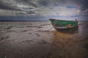 dramatic sky above the boat on the baltic sea coast