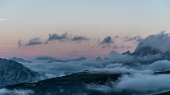 sunrise over misty mountains