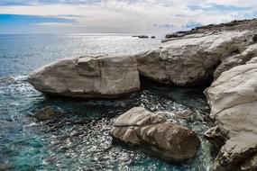 Beautiful rocky coast of Alamanos in Cyrpus, Greece, under the blue sky with clouds