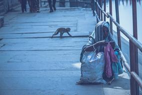 Old lady, other people and monkey, on the Jamuna coast