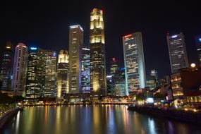 Coast of Singapore, with buildings and colorful lights, at the night