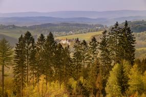 Beautiful and colorful landscape with mountains with trees and monastery, in Sauerland, Germany