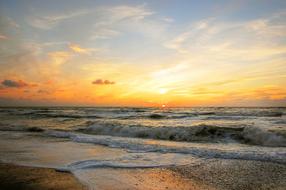 sun over the coast of denmark at dusk