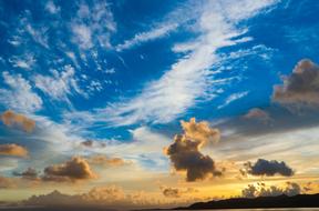 Beautiful and colorful sunset with clouds and blue sky