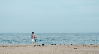 kid and father on Ocean Water shore