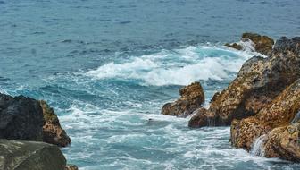 Beautiful landscape of the seashore with rocks, in waves, in Hawaii, USA