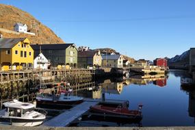 Beautiful and colorful buildings on the coast of the sea in Nyksund, Norway