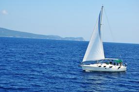 white yacht at sea on a sunny day