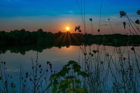 sunset over the lake on a quiet evening