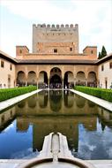 Beautiful, green garden with plants and water, in Alhambra, Granada, Spain