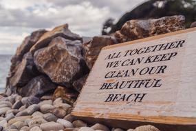 Colorful sign on the colorful peddles of the sea, under the clouds