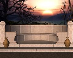 sunset behind a stone bench