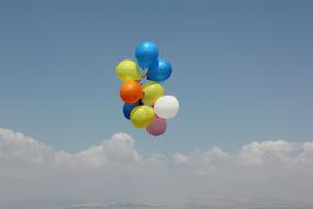 colorful flying balloons on sky