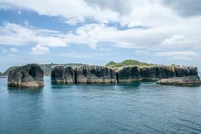 Beautiful and colorful, rocky islands in New Zealand, with green plants