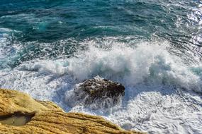 Beautiful waves on the colorful rocks in sunlight, in Ayia Napa, Cyprus