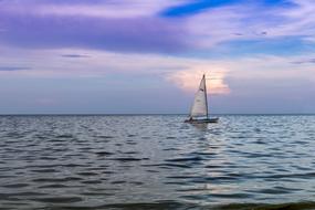 lonely Sailboat on Sea at twilight