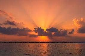 dawn in the clouds over the water
