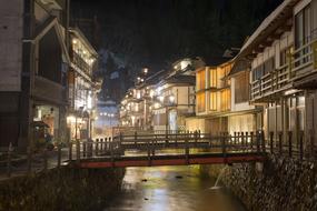 Beautiful and colorful houses and bridges in Yamagata, Japan, with lights, in the evening