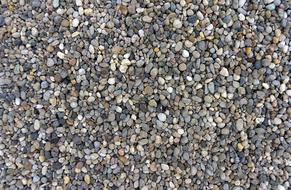 Colorful and beautiful pebbles as texture on the beach