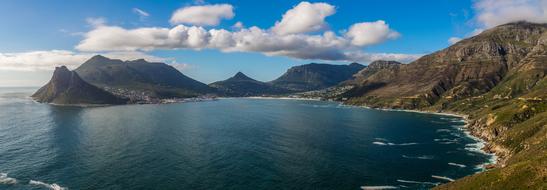 Beautiful and colorful mountains at the Hout Bay in Cape Town, South Africa, under the blue sky with clouds