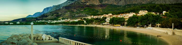 Beautiful and colorful panorama of the coast of the sea in Croatia, near the mountain with plants