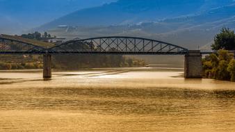 metal bridge over the river in portugal