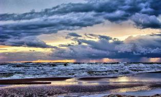 clouds over Baltic Sea Beach at evening