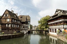 old traditional half-timbered houses on waterside at summer