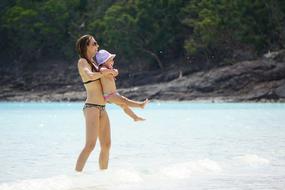 baby and mother on Beach Coast