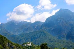 building on top of green mountains